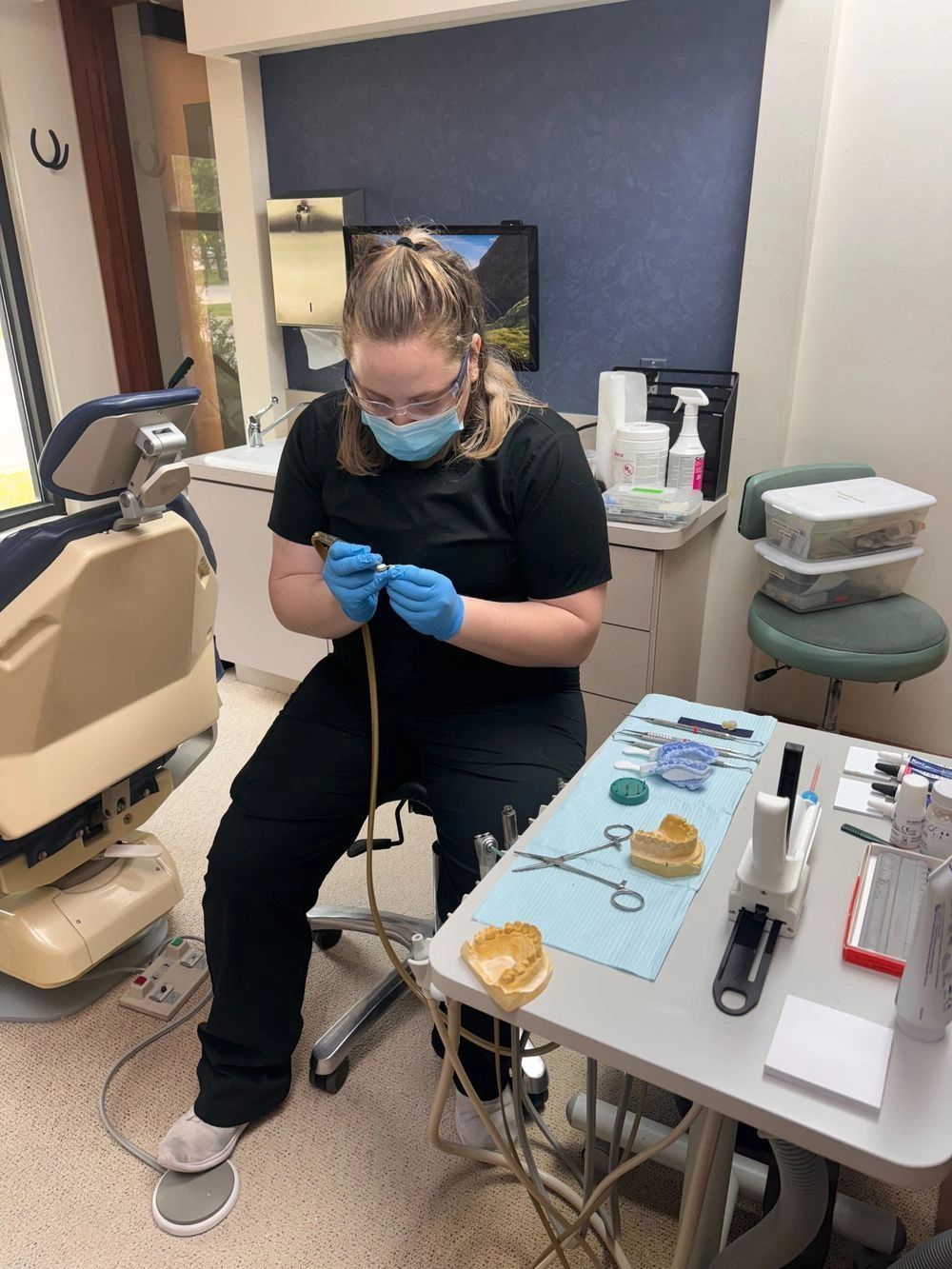 Dental Assistant Student training with a dental impression